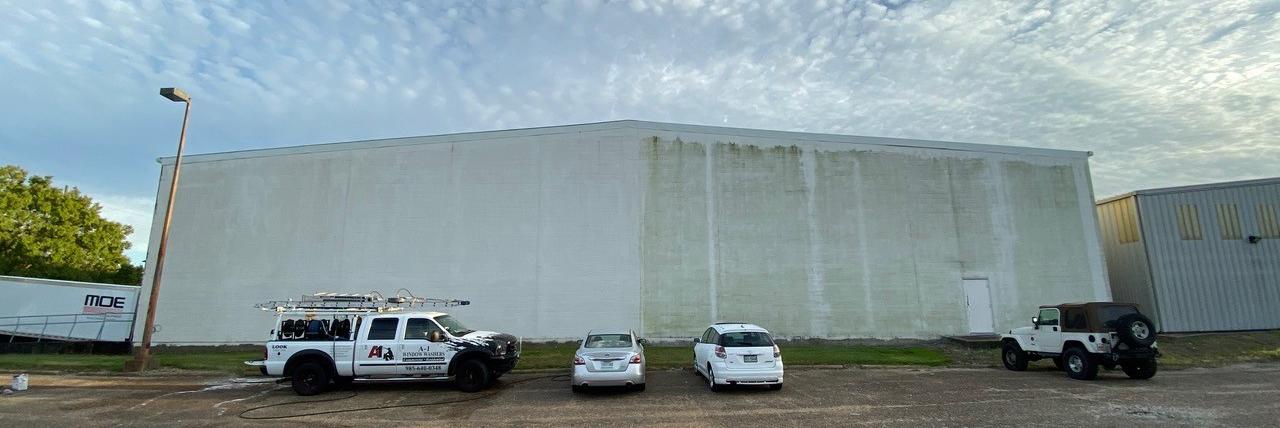 Image of a large commercial building in the process of being washed by A-1 Window Washers