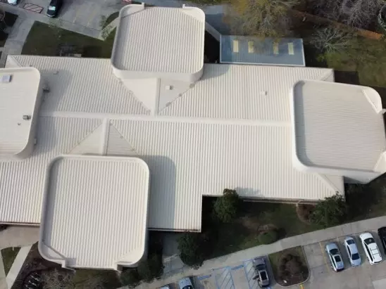 image of a commercial building's roof after a professional roof washing by A-1 Window Washers