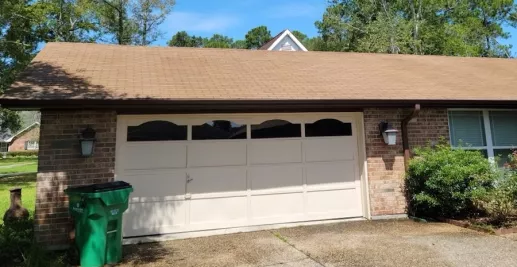 image of a home garage and roof after a professional wash by A-1 Window Washers