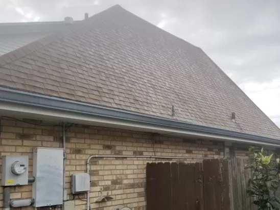 image of brick home and roof before a professional washing by A-1 Window Washers